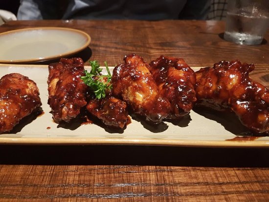 Q39 signature dishes Best Wings on the Planet, Smoked and Grilled Pork Belly, Smoked Beef Brisket.